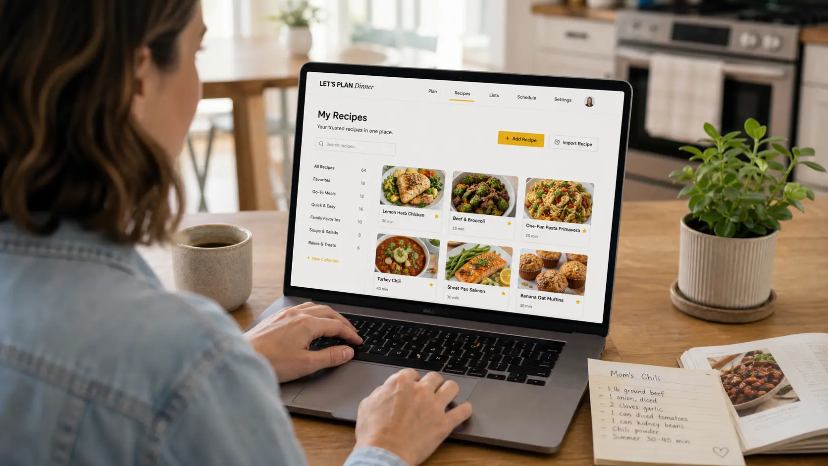 A person using the Let's Plan Dinner recipe library on a laptop beside a handwritten recipe